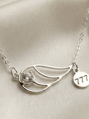 777 Angel Number Wing Necklace with White Topaz